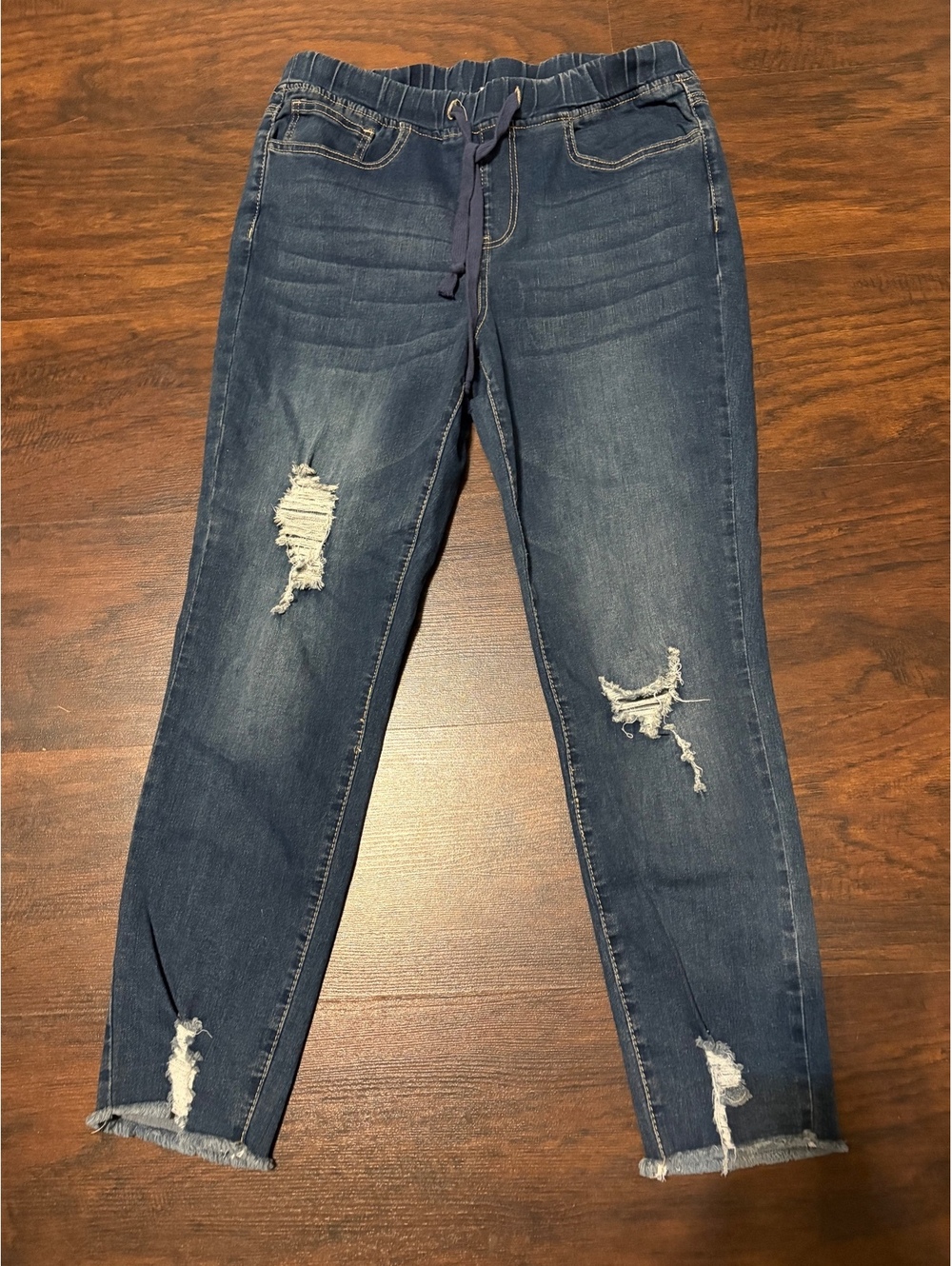 Size Medium distressed elastic waist jeans
